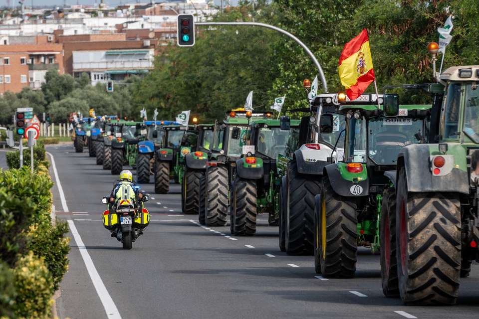 epa10727324 Farmers from various regions of Spain with their tractors take part in a farmers' protest in Madrid, Spain, 05 July 2023. Spanish farmers staged a protest called by the 'Farmers Unions' association against the rise of costs and demand the central government's assistance to confront the drought and the rise of costs.  EPA/Javier Lizon