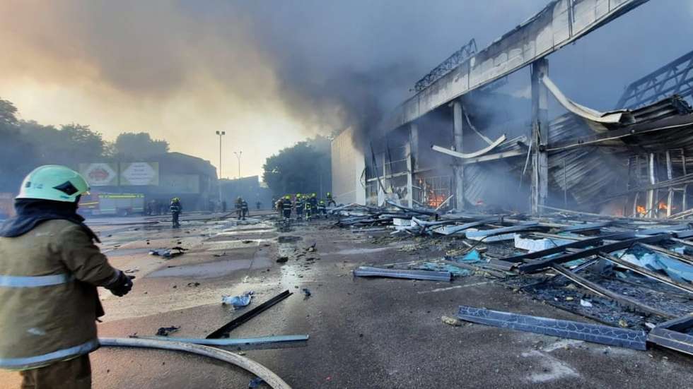 epa10036939 A handout photo released by the press service of the State Emergency Service (SES) of Ukraine shows firefighters and rescue services extinguishing a fire at a shopping center in Kremenchuk, Ukraine, 27 June 2022. The State Emergency Service (SES) of Ukraine said that, confimation pending, at least two 2 people died and 20 were injured in the fire following missile strikes. The one-story building of a shopping center was hit by rockets, the SES stated further.  EPA/STATE EMERGENCY SERVICE OF UKRAINE HANDOUT -- BEST QUALITY AVAILABLE -- MANDATORY CREDIT: STATE EMERGENCY SERVICE OF UKRAINE -- HANDOUT EDITORIAL USE ONLY/NO SALES