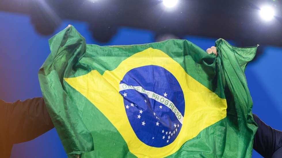 epa13132810 Brazilian Senator Flavio Bolsonaro (2R) reacts during the national convention of Brazil's Liberal Party (PL) in Sao Paulo, Brazil, 25 July 2026. The Liberal Party, led by former President Jair Bolsonaro, kicked off its national convention to nominate his eldest son, Senator Flavio Bolsonaro, as its candidate for the upcoming presidential election in October 2026.  EPA/ISAAC FONTANA