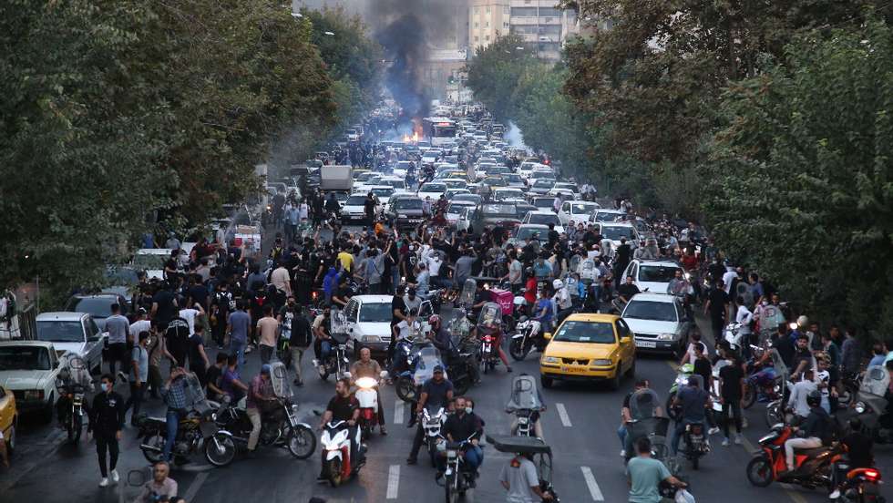 epa10197708 People clash with police during a protest  following the death of Mahsa Amini, in Tehran, Iran, 21 September 2022. Mahsa Amini, a 22-year-old Iranian woman, was arrested in Tehran on 13 September by the morality police, a unit responsible for enforcing Iran&#039;s strict dress code for women. She fell into a coma while in police custody and was declared dead on 16 September, with the authorities saying she died of a heart failure while her family advising that she had no prior health conditions. Her death has triggered protests in various areas in Iran and around the world. According to Iran&#039;s state news agency IRNA, Iranian President Ebrahim Raisi expressed his sympathy to the family of Amini on a phone call and assured them that her death will be investigated carefully. Chief Justice of Iran Gholam-Hossein Mohseni-Eje&#039;i assured her family that upon its conclusion, the investigation results by the Iranian Legal Medicine Organization will be announced without any special considerations.  EPA/STR