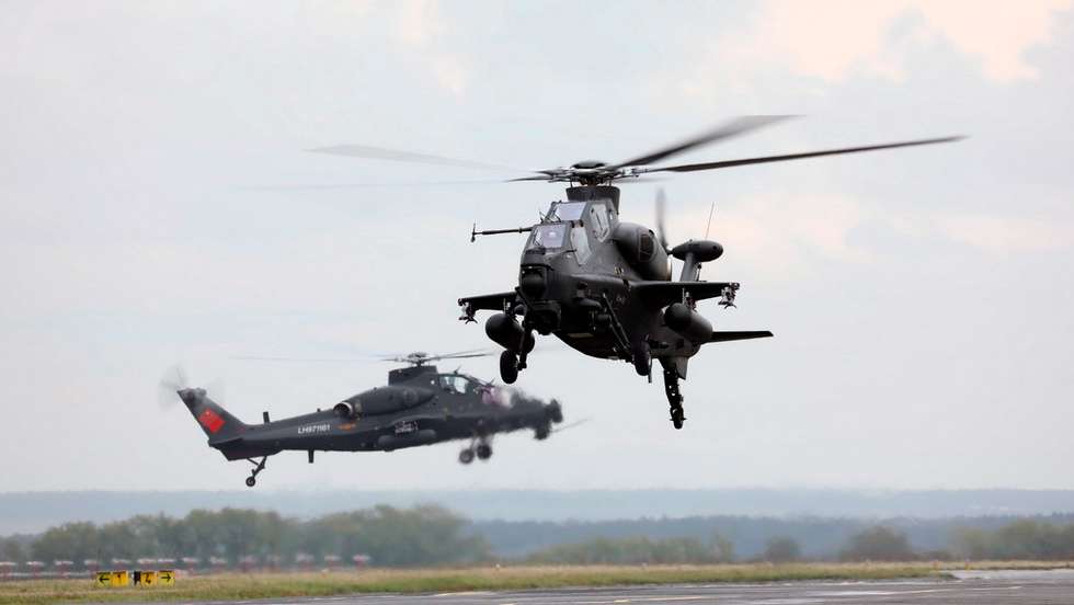 epa07830020 A handout photo made available by the Ministry of Defence of the Russian Federation
shows Changhe Aircraft Industries Corporation (CAIC) Z-10 combat helicopters of the Chinese army landing at an airport of Cheliabinsk, Russia, 06 September 2019 (reissued 09 September 2019). Eight helicopters arrived to take part in strategic drills Tsentr-2019 together with Russian army, which will run from 16 to 21 September. Some units of China, Pakistan, India and post Soviet Central Asian states take part in the drills to train collective actions.  EPA/Russian Ministry of Defence HANDOUT HANDOUT PHOTO
EDITORIAL USE ONLY HANDOUT EDITORIAL USE ONLY/NO SALES