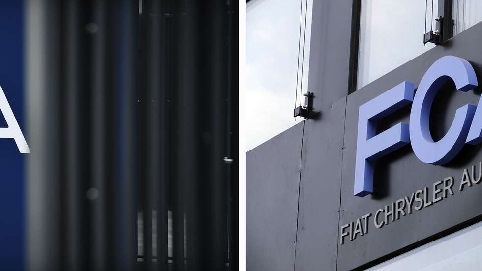 epa08918832 (FILE) - A view of signage at the PSA Group headquarters in Rueil-Malmaison, near Paris, France, 31 October 2019 (L) and signage of Italian-US car manufacturer FCA, Fiat Chrysler Automobiles, at an office building in Frankfurt am Main, Germany, 04 May 2018 (reissued 04 January 2021). Media reports on 04 January state SA Group  and FCA are on 04 May looking for approval from both companies' shareholders for their planned 52 billion USD merger deal. If approved, the deal would create world's 4th biggest car maker that the two plan to call  Stellantis.  EPA/JULIEN DE ROSA / MAURITZ ANTIN *** Local Caption *** 56457163