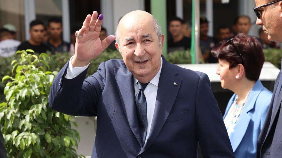 epa11591258 A handout picture provided by the Algerian Presidency Press Service shows Algerian President, Abdelmadjid Tebboune (L), reacting outside of a polling station during the Presidential elections in Algiers, Algeria, 07 September 2024. According to the National Independent Authority for Elections (ANIE), more than 24 million Algerians are called to the polls to elect a new president of the republic for a five-year term. Three candidates are running for this election; the national secretary of the Socialist Forces Front (FFS), Youcef Aouchiche, the president of the Movement of Society for Peace (MSP), Abdelaali Hassani Cherif, and the current president, Abdelmadjid Tebboune.  EPA/ALGERIAN PRESIDENCY / HANDOUT HANDOUT EDITORIAL USE ONLY/NO SALES