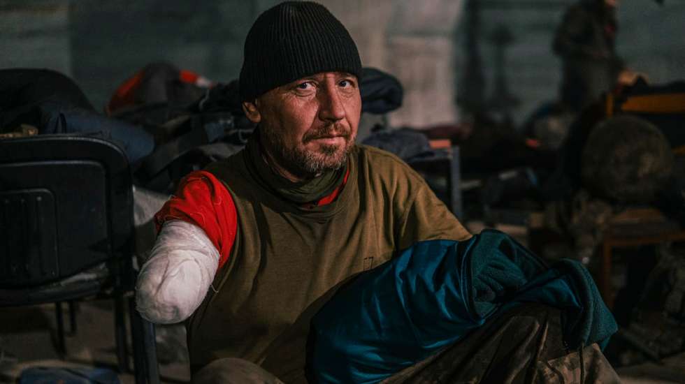 epa09940174 A handout picture made available by Regiment Azov press service shows an injured Ukrainian serviceman in a shelter at the Azovstal Iron and Steel Plant in Mariupol, Ukraine, 10 May 2022 (issued 11 May 2022). The Regiment Azov via their Telegram channel on 10 May 2022 have described the situation of their servicemen as "complete unsanitary conditions, with open wounds bandaged with non-sterile remnants of bandages, without the necessary medication and even food" and demanded evacuation to Ukrainian-controlled territory. On 24 February, Russian troops entered Ukrainian territory starting a conflict that has provoked destruction and a humanitarian crisis. According to data released by the UNHCR on 10 May, close to six million Ukrainians have fled their country since 24 February 2022.  EPA/REGIMENT AZOV PRESS SERVICE HANDOUT  HANDOUT EDITORIAL USE ONLY/NO SALES