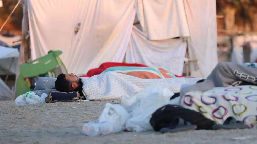 epa13198120 Migrants sleep on El Trampolin beach in Ceuta, an autonomous city of Spain on the North African coast, on 29 August 2026, a day after thousands of people protested against the situation in the city after the mass crossing of migrants on 30 July 2026.  EPA/Reduan