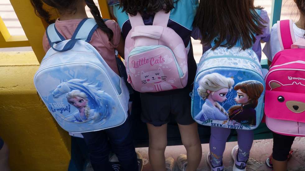 epa10166509 Children wait outside Hernan Cortes School on the first day of the 2022-23 academic year in Madrid, Spain, 07 September 2022.  EPA/JUAN CARLOS HIDALGO
