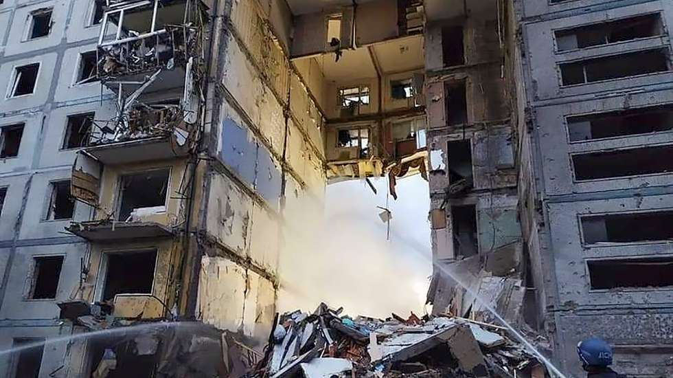epa10232217 A handout photo made available by the Ukrainian State Emergency Service shows Ukrainian rescuers work on the shelling place of residential building in Zaporizhzhia, Ukraine, 09 October 2022. At least 17 persons were killed and 49 injured as Anatoly Kurtev, Secretary of the Zaporizhzhia City Council said. Russian troops entered Ukraine on 24 February 2022 starting a conflict that has provoked destruction and a humanitarian crisis.  EPA/UKRAINIAN STATE EMERGENCY SERVICE HANDOUT HANDOUT  HANDOUT EDITORIAL USE ONLY/NO SALES