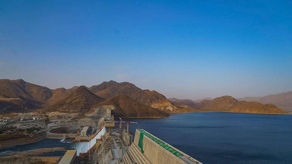 epa09775936 A handout picture made available by the Ethiopian Government of the Grand Ethiopian Renaissance Dam (GERD) during a ceremony marking the first power generation of the dam in Guba, Ethiopia, 20 February 2022 (issued 21 February 2022). The Ethiopian mega-dam began generating electricity on the Blue Nile on 20 February 2022.  EPA/Ethiopian Government HO  HANDOUT EDITORIAL USE ONLY/NO SALES