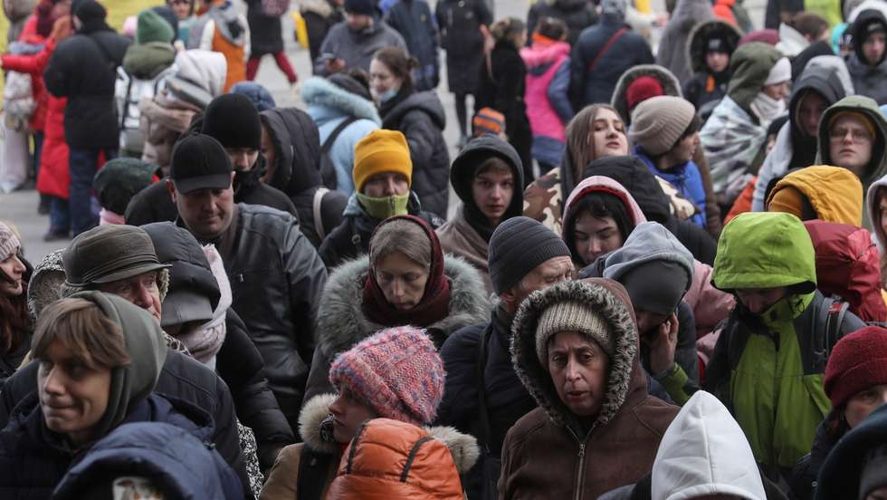epa09808307 Ukrainians wait to board on evacuation trains as they try to leave the country in Lviv train station, western Ukraine, 07 March 2022. More than 1,5 million refugees have left for neighboring countries since the invasion of the Russian army in Ukraine.  EPA/GEORGE VITSARAS