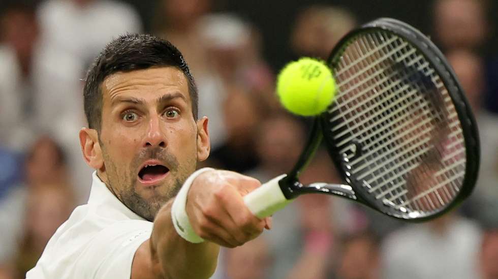 epa11467363 Novak Djokovic of Serbia in action against Holger Rune of Denmark (unseen) during their round of 16 match at the Wimbledon Championships, Wimbledon, Britain, 08 July 2024.  EPA/TIM IRELAND  EDITORIAL USE ONLY