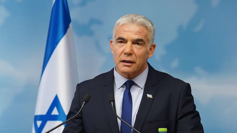 epa09780852 A handout photo made available by the GPO shows Israeli foreign minister Yair Lapid speaks on the recent Russia Ukraine escalation, in Israeli ministry of foreign affairs in Jerusalem, Israel, 24 February 2022. Russian troops launched a major military operation on Ukraine on 24 February, after weeks of intense diplomacy and the imposition of Western sanctions on Russia aimed at preventing an armed conflict in Ukraine.  EPA/Yuval Penn GPO HANDOUT Hand out picture HANDOUT EDITORIAL USE ONLY/NO SALES