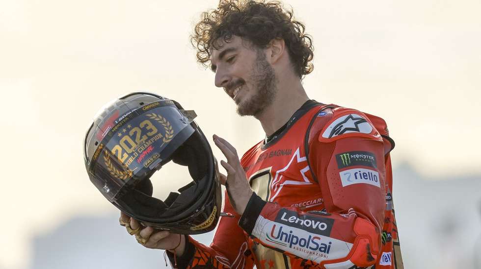 epa10996336 Italian MotoGP rider Francesco Bagnaia of Ducati Lenovo celebrates becoming World Champion after his win in the motorcycling Grand Prix of Valencia at Ricardo Tormo circuit in Cheste, Valencia, Spain, 26 November 2023.  EPA/BIEL ALINO