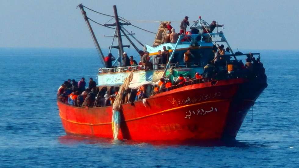 epa04255734 A handout picture released by the Italian Coast Guard shows a boat carrying 281 refugees, at sea off the coast of Calabria Region, Italy, 14 June 2014.  Nearly 300 migrants who said they were refugees from Syria have been rescued off the Italian coast, officials. The coast guard said two patrol boats and a a tax police vessel picked up 281 people from a 20-metre fishing boat some 150 kilometres away from the coast of Calabria, the region that forms the tip of Italy's boot. The migrants were spotted in the Mediterranean between Greece and Italy. Among the rescued passengers were 93 children and six women, some of who were in a precarious medical condition, the coast guard said.  EPA/ITALIAN COASTGUARD / HANDOUT  HANDOUT EDITORIAL USE ONLY/NO SALES/NO ARCHIVES