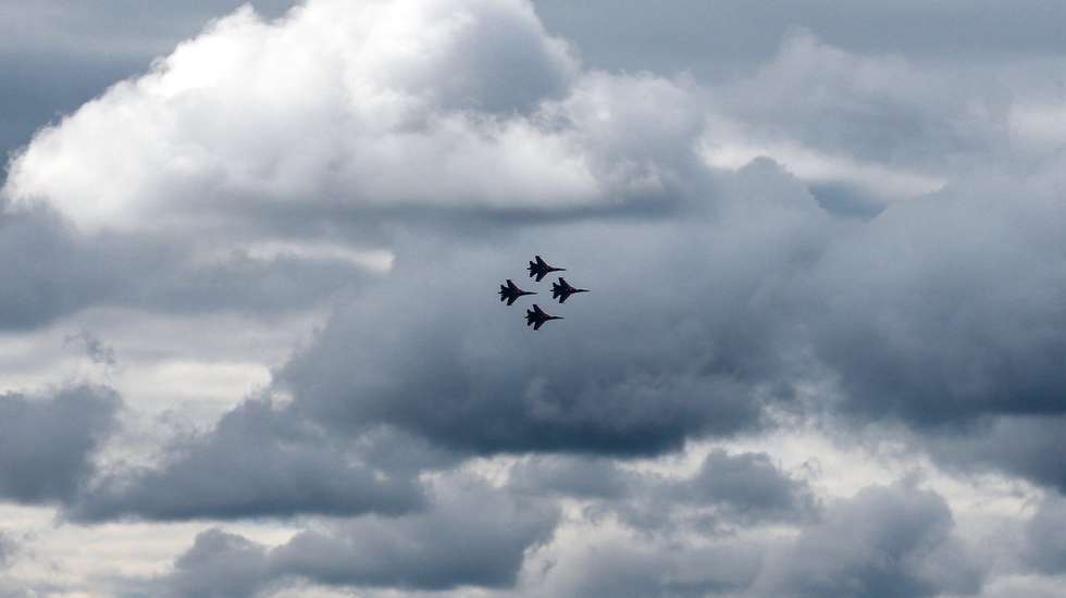 epa05531685 Russian Air Force Russian Knights (Russkie Vityazi) fly the Sukhoi Su-27 aircrafts to performs during a demonstration program of the International Military-Technical Forum 'ARMY-2016' in the Russian Armed Forces 'Patriot' Park in Kubinka, Moscow region, Russia, 09 September 2016. Hundreds of the Russian defense companies and weapon manufacturers will take part in the event, displaying an estimated 5,000 pieces of weaponry and military equipment, ranging from helicopters and fighter jets to tanks and small arms.  EPA/SERGEI ILNITSKY