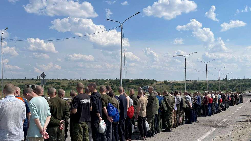 epa10042215 A handout picture made available by the press service of the Defense Intelligence of the Ministry of Defense of Ukraine, shows Ukrainian prisoners of war who were released as part of a prisoner swap with Russia, walking towards the Ukrainian side at an undisclosed location, Ukraine, 29 June 2022. The 144 Ukrainian soldiers were released from Russian captivity, 95 of them were part of the Azovstal (Mariupol) fighters. According to a statement by the Ukrainian Presidential Office on 06 June quoting President Zelensky, there may be more than 2,500 prisoners from the Azovstal plant being held captive by Russian forces.  EPA/Defense Intelligence Ministry of Defense of Ukraine HANDOUT EDITORIAL USE ONLY NO SALES HANDOUT EDITORIAL USE ONLY/NO SALES