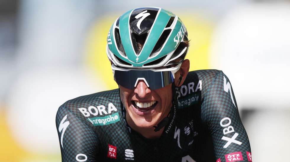 epa09331841 German rider Nils Politt of the Bora-Hansgrohe team after he crosses the finish line and wins the 12th stage of the Tour de France 2021 over 159.4 km from Saint Paul Trois Chateaux to Nimes, France, 08 July 2021.  EPA/GUILLAUME HORCAJUELO