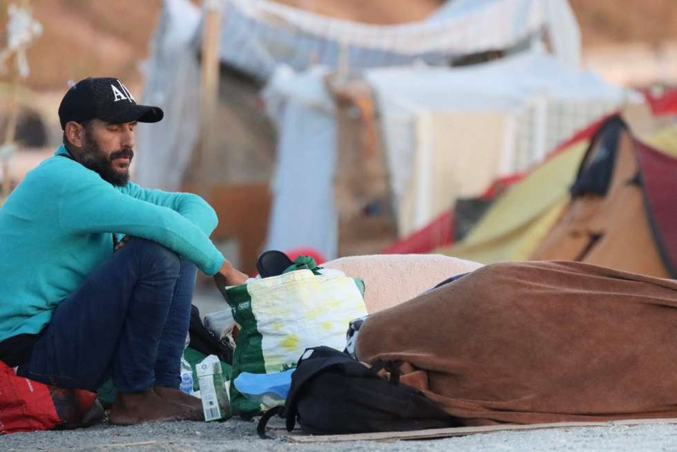 epaselect epa13198121 Migrants sleep on El Trampolin beach in Ceuta, an autonomous city of Spain on the North African coast, on 29 August 2026, a day after thousands of people protested against the situation in the city after the mass crossing of migrants on 30 July 2026.  EPA/Reduan