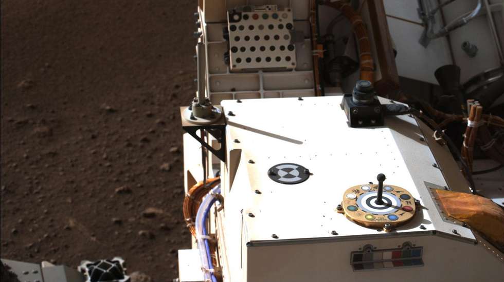 epa09030189 A handout photo made available by NASA shows Mastcam-Z, a pair of zoomable cameras aboard NASA’s Perseverance rover, images its calibration target for the first time since the rover landed on Mars on 18 February 2021 (Isuued on 22 February 2021). The target is used as a reference marker so scientists can adjust the colors and settings on the cameras. A key objective for Perseverance's mission on Mars is astrobiology, including the search for signs of ancient microbial life. The rover will characterize the planet's geology and past climate, pave the way for human exploration of the Red Planet, and be the first mission to collect and cache Martian rock and regolith.  EPA/NASA/JPL-Caltech HANDOUT  HANDOUT EDITORIAL USE ONLY/NO SALES