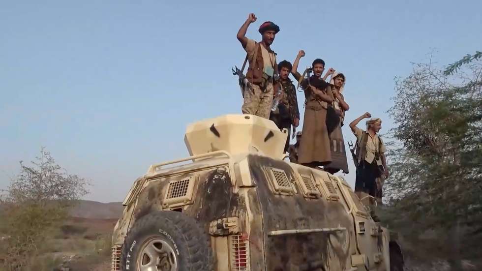 epa13237567 A screen grab taken from an undated handout video released on 13 September 2026 by the Houthi military media center shows Houthi fighters gesturing on an armored personnel carrier during an offensive in the port city of Mokha, western coast of Yemen. Yemen's Saudi-backed government accused Iran and its regional allies of supporting the Houthis’ recent offensive, during which the group captured key port areas, including Mokha, and seized control of strategic maritime positions along the Bab al-Mandab Strait.  EPA/HOUTHI MILITARY MEDIA CENTER HANDOUT HANDOUT EDITORIAL USE ONLY/NO SALES