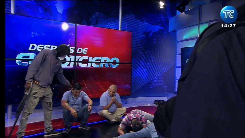 epa11066450 A handout photo made available by Chilean state-owned television network TC Television of a frame taken during the transmission of a TC Noticias newscast, showing the moment in which it was interrupted by armed men, in Guayaquil, Ecuador, 09 January 2024. Hooded armed men entered the TC Television studios in the city of Guayaquil, southwestern Ecuador and subdued its staff during a live broadcast.  EPA/TC Noticias HANDOUT ONLY AVAILABLE TO ILLUSTRATE THE ACCOMPANYING NEWS (MANDATORY CREDIT) HANDOUT EDITORIAL USE ONLY/NO SALES HANDOUT EDITORIAL USE ONLY/NO SALES