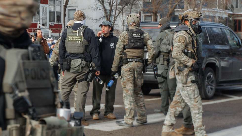 epa12645190 A community member blows a whistle as he is surrounded by federal immigration enforcement agents during a confrontation in Minneapolis, Minnesota, USA, 12 January 2026. As part of a federal immigration crackdown involving over 2,000 agents from Border Patrol, Immigration and Customs Enforcement (ICE), and Homeland Security Investigations (HSI), an ICE officer fatally shot US citizen Renee Nicole Good in her vehicle during an operation in South Minneapolis on 07 January 2026.  EPA/OLGA FEDOROVA