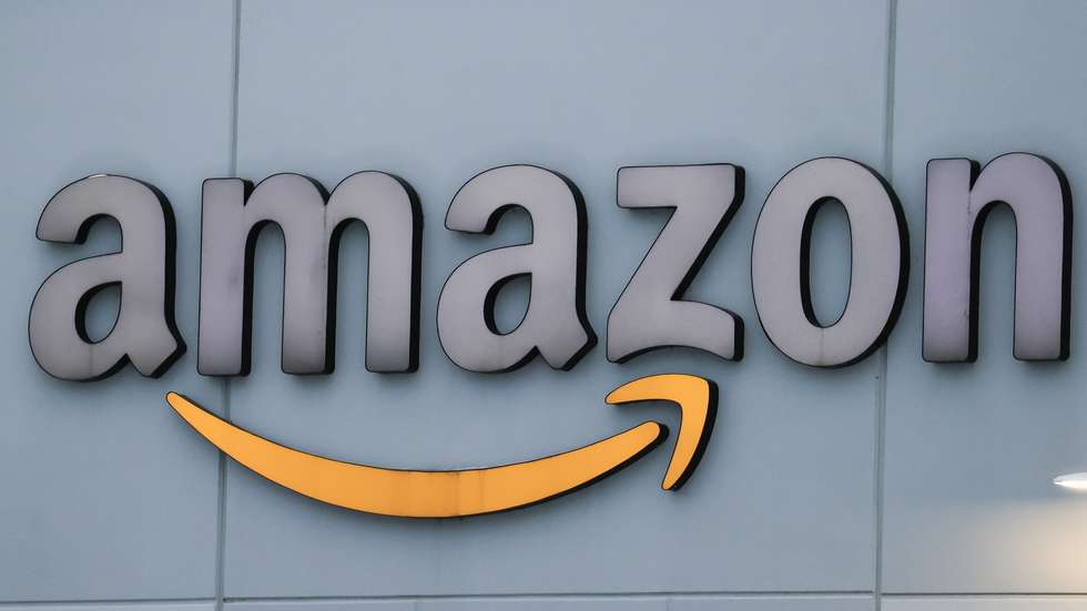epa08982843 An Amazon warehouse is outfitted with the Amazon logo in Waukegan, Illinois, USA, 02 February 2021. Amazon CEO Jeff Bezos has announced that he will leave his position in the summer of 2021, turning it over to Amazon's cloud computing Chief Executive Andy Jassy. Bezos will become executive chairman. Amazon reported 125.56 billion US dollars in its quarterly revenue, its largest to date.  EPA/TANNEN MAURY