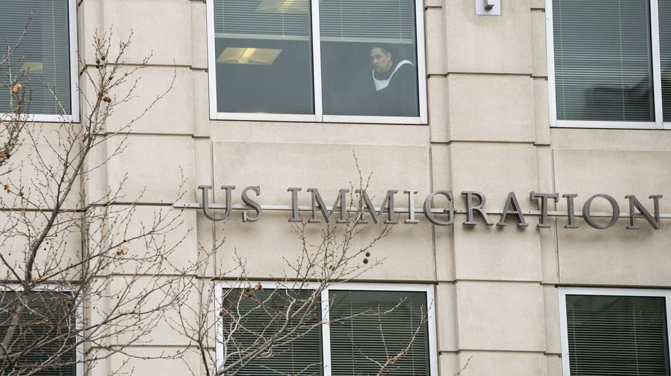 epa11964795 A worker inside the Immigration and Customs Enforcement (ICE) headquarters watches a protest calling for the release of arrested Palestinian student protester Mahmoud Khalil in Washington, DC, USA, 14 March 2025. Last week in New York, federal agents arrested Khalil, an American green card holder who led protests against Israel's operations in Gaza at Columbia University last year, and then quickly transferred him to Louisiana for deportation proceedings.  EPA/GRAEME SLOAN