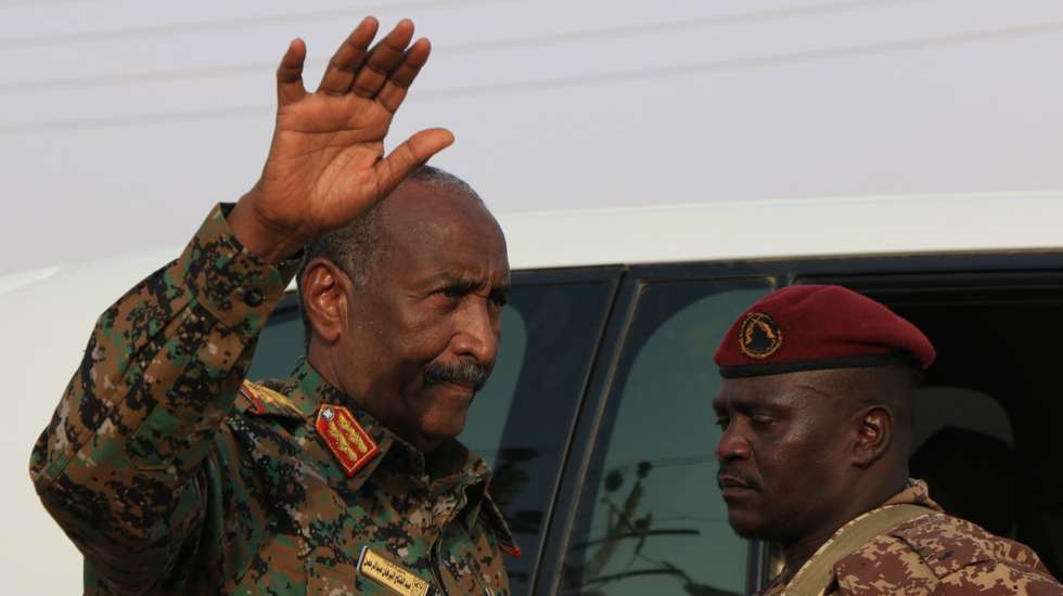 epa11571600 Sudan's President of the Transitional Sovereign Council Abdel-Fattah Al-Burhan Abdelrahman Al-Burhan (L) greets people as he visits a flood-affected area in Masawi, the northern state of Merowe, Sudan, 29 August 2024. At least 148 people have died in Sudan due to flooding and heavy rains, according to a Sudan's Health Ministry statement on 26 August 2024. A total of 31,666 families and 129,650 individuals were affected by the flooding in ten states, the statement reads. Over 12,400 homes have completely collapsed and 11,472 partially damaged mainly in the Sudanese Northern and River Nile states.  EPA/STR