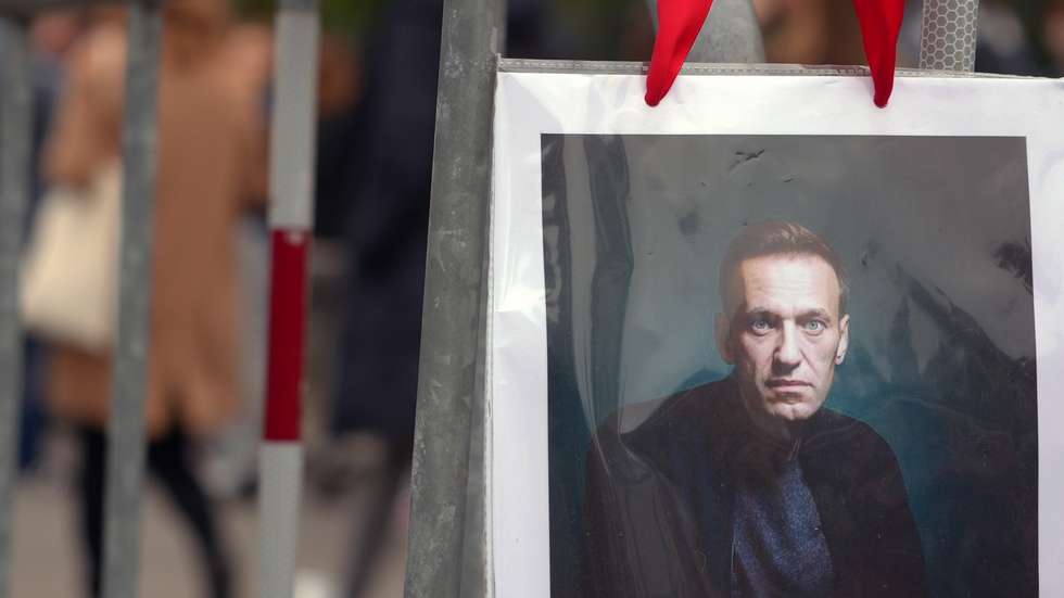 epa11226186 A portrait of Alexei Navalny is seen as Russians living in Switzerland gather in front of the Russian embassy in Bern to take their vote during the Russian presidential elections and simultaneously protest against President Putin in Bern, Switzerland, 17 March 2024. The Russian presidential election vote takes place between 15 and 17 March. Four candidates registered by the Central Election Commission of the Russian Federation are vying for the post of head of state: Leonid Slutsky, Nikolai Kharitonov, Vladislav Davankov and Vladimir Putin.  The team of late Russian opposition leader Alexei Navalny had called Russians to show their opposition to the elections and President Putin, by crowding voting centers on 17 March at midday. The protest was named 'Noon Against Putin'.  EPA/JULIEN GRINDAT