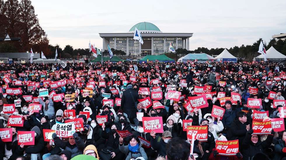 epa11763949 Rally participants call for the impeachment of President Yoon Suk Yeol in front of the National Assembly in Seoul, South Korea, 07 December 2024 (issued 08 December 2024). President Yoon survived an opposition-led motion on 07 December, that sought to impeach him for his short-lived declaration of martial law, as it did not meet the required quorum after governing party lawmakers boycotted the vote.  EPA/YONHAP SOUTH KOREA OUT