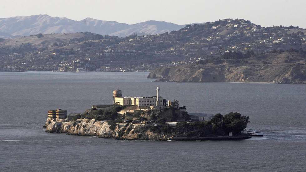 epa03257930 FILE - File photo of former Alcatraz Prison in the middle of San Francisco Bay in San Francisco, California, USA, 05 October 2009. 'Wanted' posters were issued by the US Marshals in Washington DC, USA, 07 June 2012, of fugitives Frank Morris, and brothers John and Clarence Anglin. The US Marshals have also included a computerized rendition of how they may look in 2012 if still alive. They are the only men to escape from Alcatraz Island in San Francisco, California, who remain unaccounted for. The three escaped on 11 June 1962, after having burrowed through their cells, by means of a makeshift raft. The case was closed by the FBI on 31 December 1979, after a 17-year investigation, but remains open for the US Marshals and there is still an active warrant for them.  EPA/MATT CAMPBELL