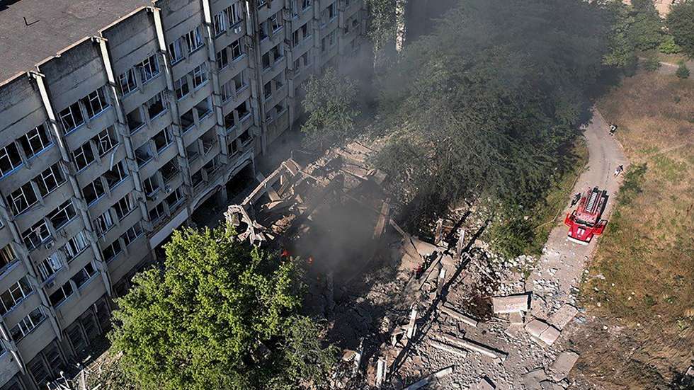 epa10076280 A handout photo made available by the press service of the State Emergency Service of Ukraine shows firefighters and rescuers work at a building damaged in a shelling in Mykolaiv, Ukraine, 17 July 2022.According to Mykolaiv Regional State Administration head Vitaly Kim, Mykolaiv was under massive rocket fire in which two industrial enterprises caught fire.  EPA/UKRAINIAN STATE EMERGENCY SERVICE / HANDOUT  HANDOUT EDITORIAL USE ONLY/NO SALES