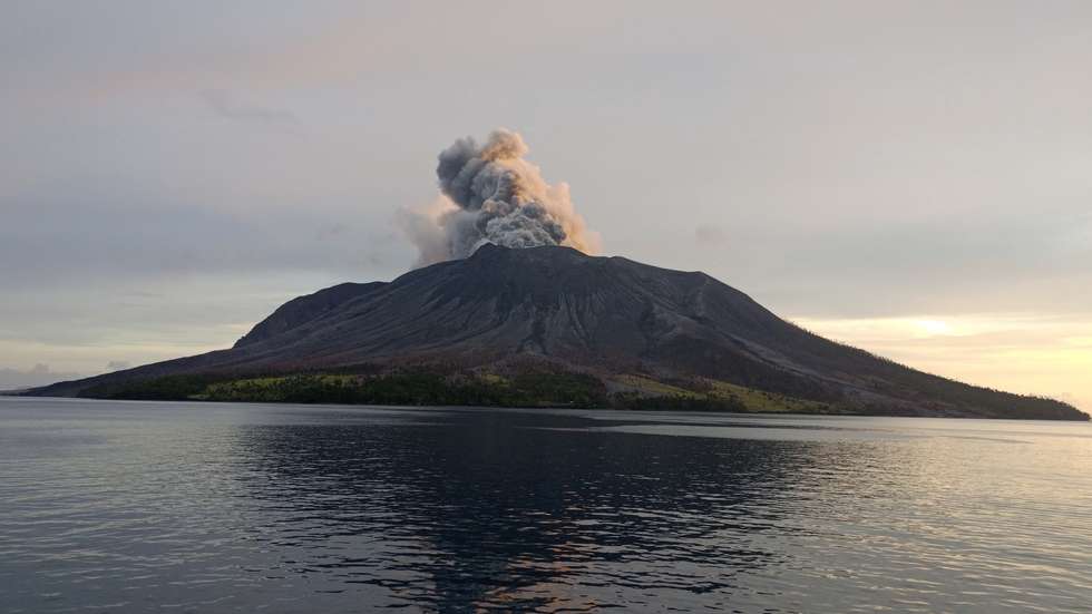 epa11288018 A handout photo made available by the Indonesian National Search and Rescue Agency (BASARNAS) shows smoke and ash erupting from Mount Ruang as seen from Tagulandang village, in North Sulawesi, Indonesia, 19 April 2024. The Center for Volcanology and Geological Disaster Mitigation (PVMBG) of the Ministry of Energy and Mineral Resources reported that Mount Ruang in the Sitaro Islands Regency, North Sulawesi, erupted on 16 April night. As a result of the eruption of Mount Ruang, 272 families, or around 828 people, were evacuated.  EPA/BASARNAS HANDOUT  HANDOUT EDITORIAL USE ONLY/NO SALES HANDOUT EDITORIAL USE ONLY/NO SALES HANDOUT EDITORIAL USE ONLY/NO SALES