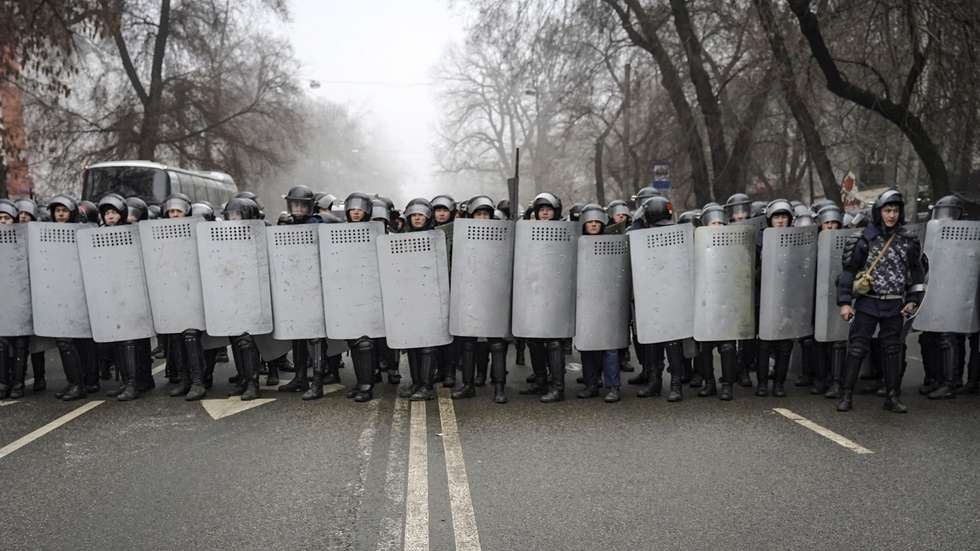 epa09667759 Riot police officers patrol in a street during rally over a hike in energy prices in Almaty, Kazakhstan, 05 January 2022. Protesters stormed the mayor's office in Almaty, as Kazakh President Kassym-Jomart Tokayev declared a state of emergency in the capital until 19 January 2022.  EPA/STR