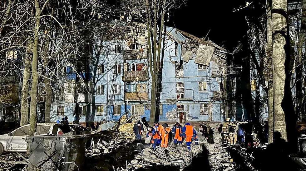 epa10498411 A handout photo made available by Anatoliy Kurtev, the Secretary of the Zaporizhzhia City Council telegram channel, shows rescue workers at the site of a damaged residential building in Zaporizhzhia, Ukraine, 02 March 2023. At least two people died and 11 others were injured after a rocket hit a five-story building in Zaporizhzhia, the State Emergency Service (SES) of Ukraine report. Russian troops entered Ukraine on 24 February 2022 starting a conflict that has provoked destruction and a humanitarian crisis.  EPA/Secretary of the Zaporizhzhia City Council telegram channel HAND HANDOUT HANDOUT EDITORIAL USE ONLY/NO SALES