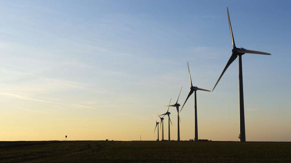 epa03045094 Wind turbines at sunset at a Wind Farm near Dieppe, Seine-Maritime, France, 27 December 2011. reports state that in keeping with the Kyoto Protocol to Reduce Greenhouse Gases and in conformity with a European directive on the development of renewable energy, France has  implemented an ambitious policy regarding eolic energy.  EPA/HORACIO VILLALOBOS