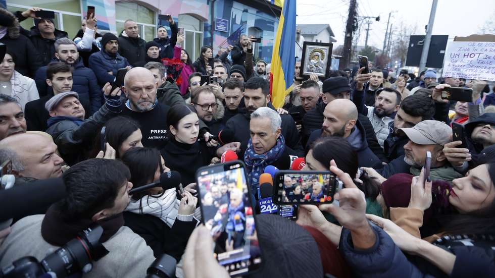 epaselect epa11764093 Calin Georgescu, Romania's independent candidate who won the first round of the presidential elections, talks to the media outside the Secondary School No. 1 polling station, where he was scheduled to cast his vote in the second round of the presidential elections in Mogosoaia, near Bucharest, Romania, 08 December 2024. The Romanian Constitutional Court (CCR) annulled the first round of presidential elections on 06 December. According to the CCR, the government will set a new election date, and the entire electoral process will be re-run, beginning with candidate registration and validation.  EPA/ROBERT GHEMENT