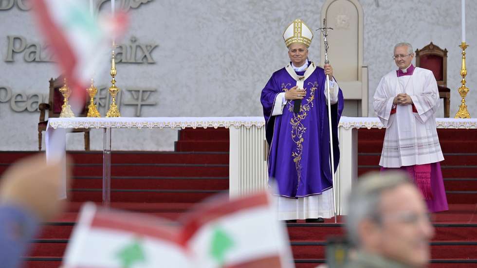 epa12564116 Pope Leo XIV (L) at the end of a Mass at the waterfront in Beirut, Lebanon, 02 December 2025. Pope Leo XIV is on his first apostolic visit outside Italy since his election as pontiff. He visited Turkey from 27 November and continues his journey to Lebanon from 30 November until 02 December.  EPA/STRINGER