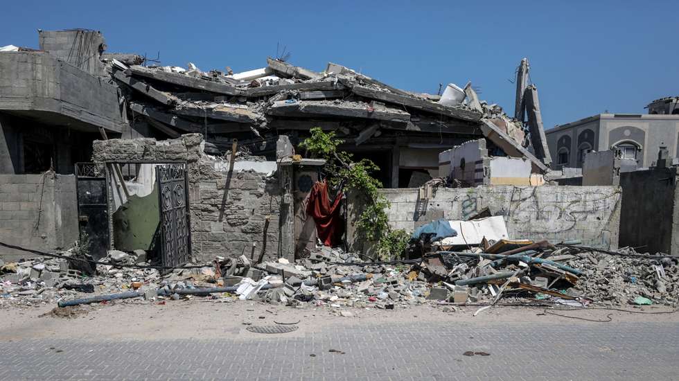 epa11468098 A view of a destroyed building following an Israeli air strike in Al Nuseirat refugee camp, central Gaza Strip, 09 July 2024. More than 16 Palestinians have been killed following Israeli air strikes in Al Nuseirat refugee camp on 09 July, according to the Palestinian Ministry of Health. The Israeli military stated that its troops are continuing 'operational activity' throughout the Gaza Strip. More than 38,000 Palestinians and over 1,455 Israelis have been killed, according to the Palestinian Health Ministry and the IDF, since Hamas militants launched an attack against Israel from the Gaza Strip on 07 October 2023, and the Israeli operations in Gaza and the West Bank which followed it.  EPA/MOHAMMED SABER