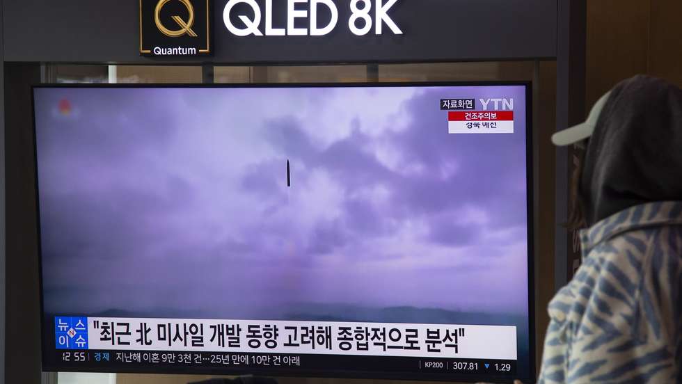 epa10525413 A woman watches the news at a train station in Seoul, South Korea, 16 March 2023. According to South Korea's Joint Chiefs of Staff (JCS), North launched a ballistic missiles early morning into the east sea amid US-South Korean joint military drills.  EPA/JEON HEON-KYUN