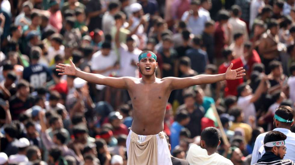 epa11528465 A Bangladeshi man chants on a street as people gather in Dhaka, Bangladesh, 05 August 2024. In an address to the nation, Chief of Army Staff General Waker-Uz-Zaman announced that Prime Minister Sheikh Hasina has resigned after weeks of unrest and an interim government will be formed to run the country. Dhaka authorities have imposed a new curfew starting 06:00 p.m. local time on 04 August. As casualties mounted and law enforcement struggled to contain the unrest, the Bangladeshi government on 20 July 2024 had imposed an initial nationwide curfew and deployed military forces after violence broke out in Dhaka and other regions following student-led protests demanding reforms to the government's job quota system.  EPA/MONIRUL ALAM