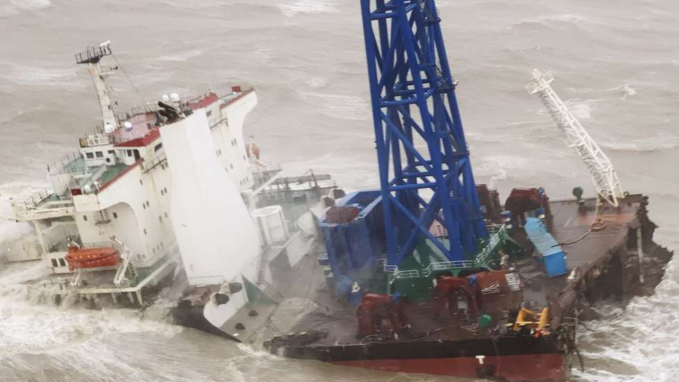 epa10047342 A handout photo made available by Hong Kong's Government Flying Service (GFS) shows the Fujing 001 vessel adrift after snapping in two off the coast of Hong Kong, China, 02 July 2022. The engineering vessel with 30 crew members on board snapped in two as Typhoon Chaba hit Hong Kong. Rescue teams managed to save three crew members while the search for the remaining 27 was still ongoing.  EPA/HONG KONG GFS HANDOUT  HANDOUT EDITORIAL USE ONLY/NO SALES