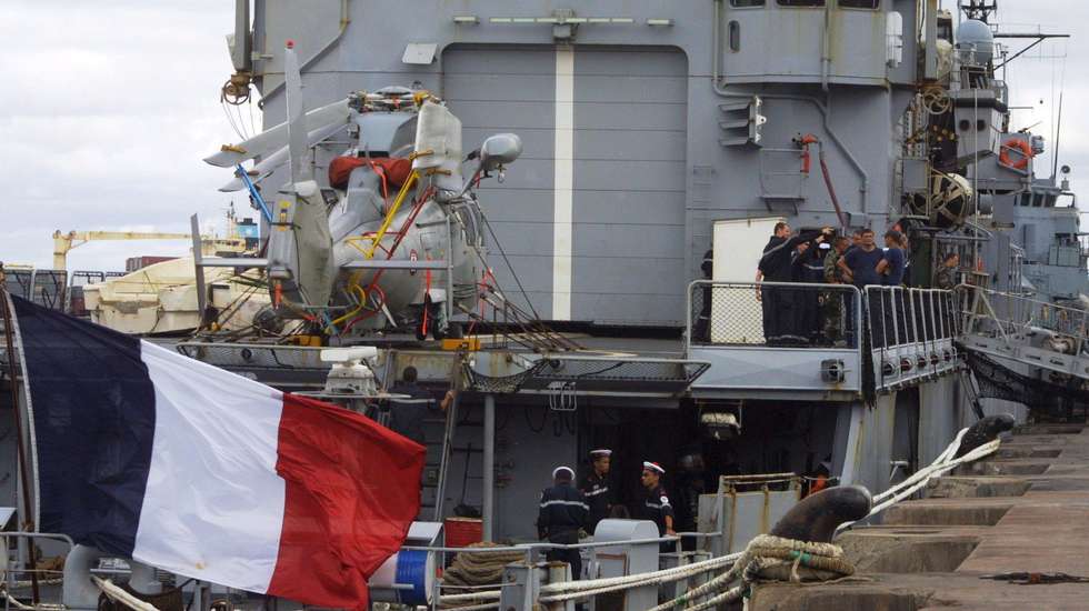 epa01705487 French Naval officers are seen aboard  the Frigate MV Nivose which docked at the port of Mombasa on 22 April 2009. The naval ship brought eleven suspected Somali pirates to hand them over to Kenyan authorities after they were arrested attempting to hijack a cargo vessel destined to Tanzania from Dubai, at least 600 nautical miles north of Kenya. The suspects will spend one night at the port police station before they are taken to court to answer charges of piracy on 23 April.  EPA/STR