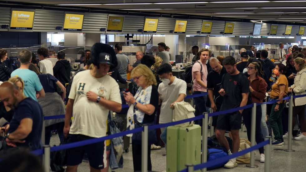 epa10153983 Passengers wait in front of a check-in counters to rebook their flights during a Lufthansa pilots strike, at the international airport in Frankfurt am Main, Germany, 02 September 2022. The pilots of Germany’s flag carrier Lufthansa and Lufthansa Cargo called for a 24-hour strike on 02 September after failed pay talks with the company. Lufthansa announced on 01 September that around 800 flights would be canceled, affecting more than 130,000 passengers.  EPA/RONALD WITTEK