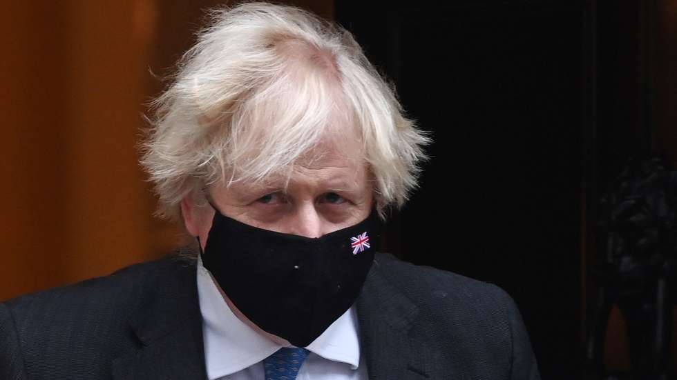 epa09642943 British Prime Minister Boris Johnson departs 10 Downing Street for Prime Ministers Questions at the parliament in London, Britain, 15 December 2021.  EPA/ANDY RAIN