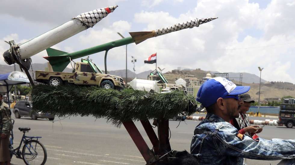 epa12075517 A person rides a motorcycle decorated with mock missiles along a street in Sana'a, Yemen, 05 May 2025. Yemen's Houthis have announced they will impose a 'comprehensive air blockade' on Israel, warning international airlines that Israel's airports are no longer safe for air traffic, a day after they claimed responsibility for a missile strike that targeted Israel's Ben Gurion airport, according to a statement by Houthi military spokesman Yahya Sarea.  EPA/YAHYA ARHAB