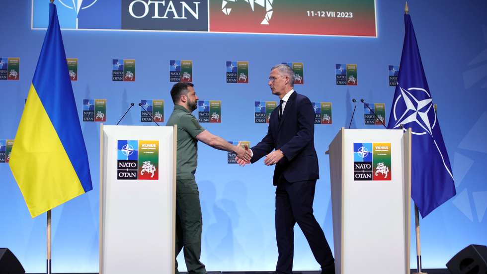 epa10741104 NATO Secretary General Jens Stoltenberg (R) and Ukraine's President Volodymyr Zelensky shake hands at the end of a joint press conference following a bilateral meeting, at the NATO ​summit in Vilnius, Lithuania, 12 July 2023. The North Atlantic Treaty Organization (NATO) Summit takes place in Vilnius on 11 and 12 July 2023 with the alliance's leaders expected to adopt new defense plans.  EPA/TIM IRELAND