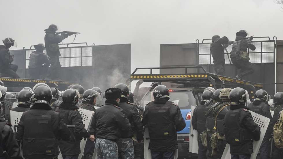 epa09667762 Riot police officers patrol in a street during rally over a hike in energy prices in Almaty, Kazakhstan, 05 January 2022. Protesters stormed the mayor's office in Almaty, as Kazakh President Kassym-Jomart Tokayev declared a state of emergency in the capital until 19 January 2022.  EPA/STR