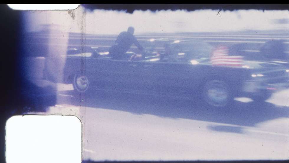 epa11588258 A handout photo made available by RR Auctions on 05 September 2024 showing a frame from an 8mm color silent film footage of then President John F. Kennedy's limousine speeding along North Stemmons Freeway, in Dallas, Texa, USA on 22 November 1962, en route to Parkland Memorial Hospital, that will be auctioned by Boston, Massachusetts USA based RR Auctions. This previously unknown footage, shot by Dale Carpenter, Sr.,  includes segments of the motorcade prior to its arrival at Dealey Plaza and, a post-assassination clip of Secret Service Agency Clint Hill protecting First Lady Jacqueline Kennedy, as the limousine was on the way to Parkland Hospital in an effort to save the President's life.  EPA/RR AUCTIONS / HANDOUT   HANDOUT EDITORIAL USE ONLY/NO SALES