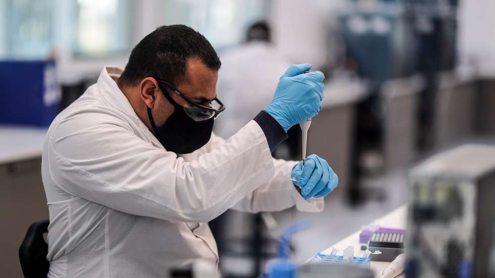 epa08603487 Workers of the mAbxience laboratory, chosen by AstraZeneca for the production in Latin America of the vaccine against COVID-19, carry out tasks in the plant that the company owns in Garin, in the province of Buenos Aires, Argentina, 14 August 2020. The Argentine laboratory mAbxience is confident that the results of the clinical trial of the vaccine developed by AstraZeneca in collaboration with the British University of Oxford will be positive and that production will begin later this year or early 2021.  EPA/Juan Ignacio Roncoroni